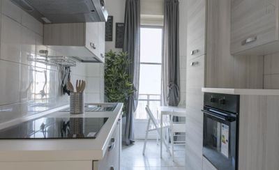 Spacious single bedroom with balcony in a 3-bedroom apartment in Lorenteggio-1